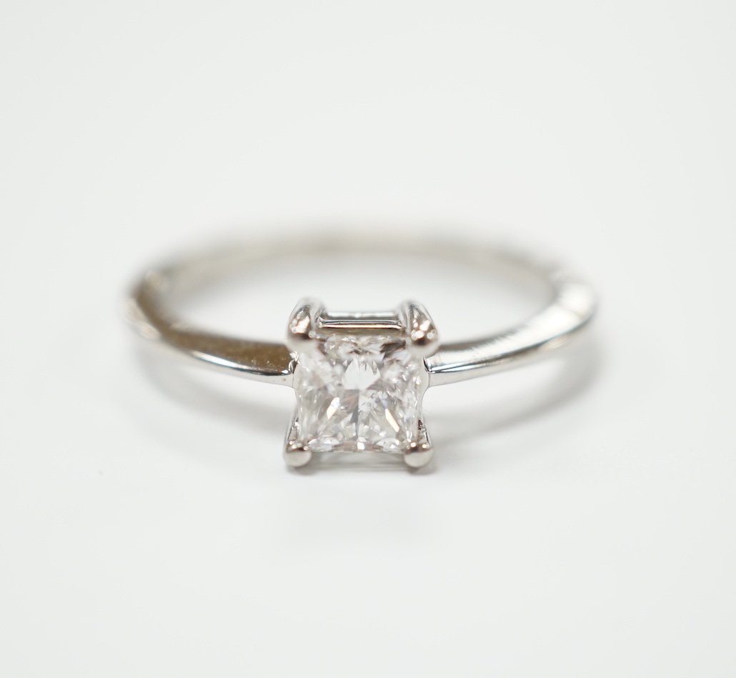 A white metal and princess cut solitaire diamond set ring, the stone weighing 0.50ct, size K, gross weight 3.4 grams.